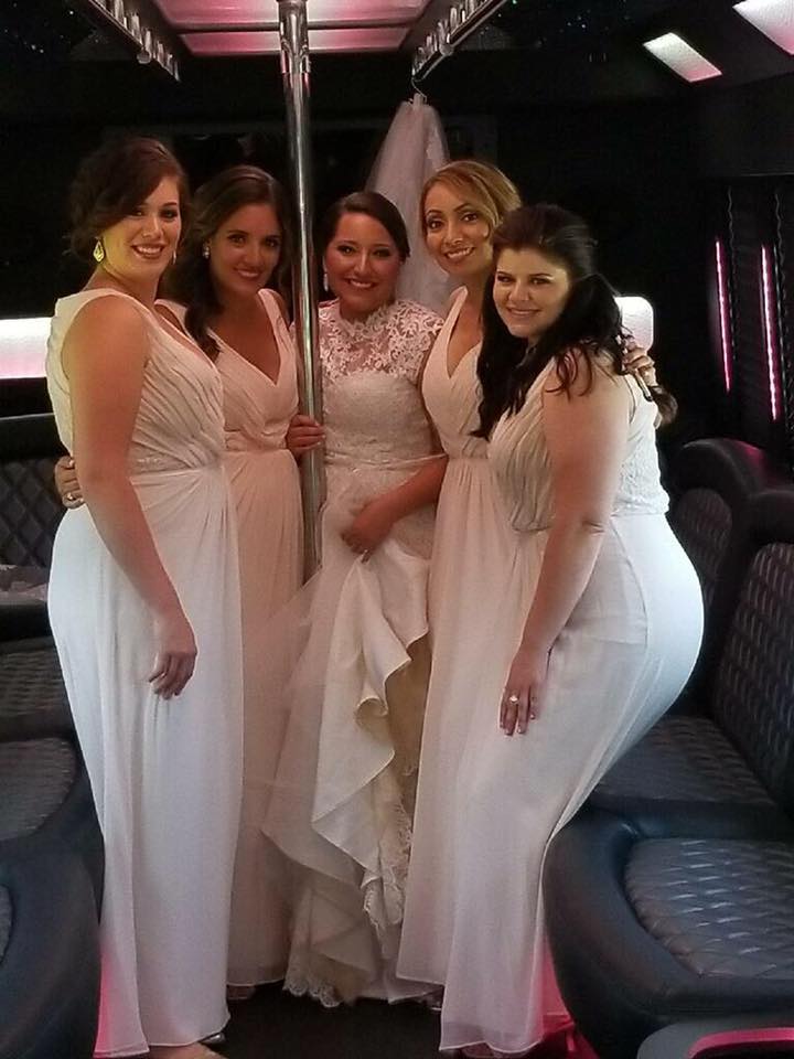 After wedding picture of bride inside one of our party busses